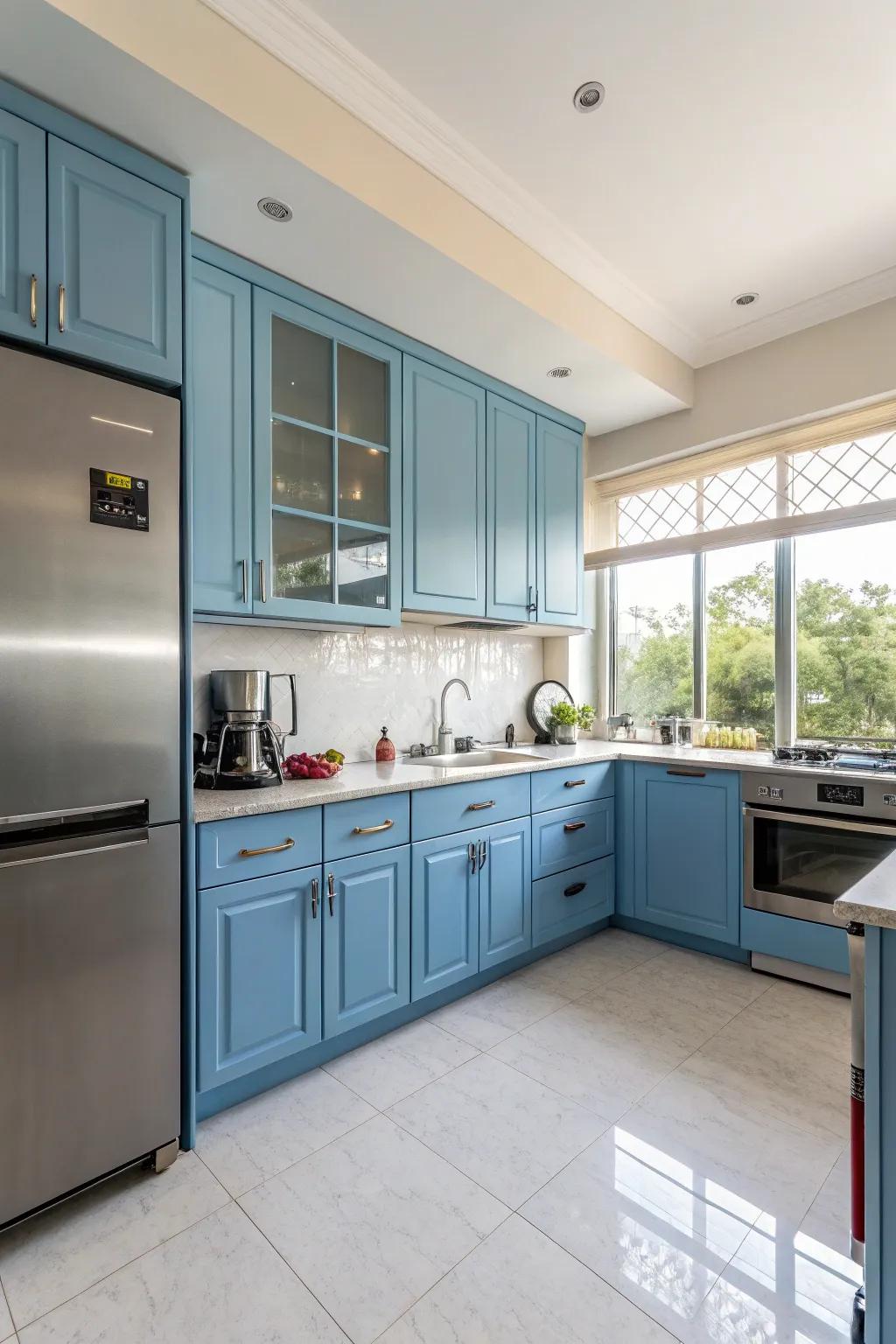 Modern sophistication with blue cabinets and stainless steel.