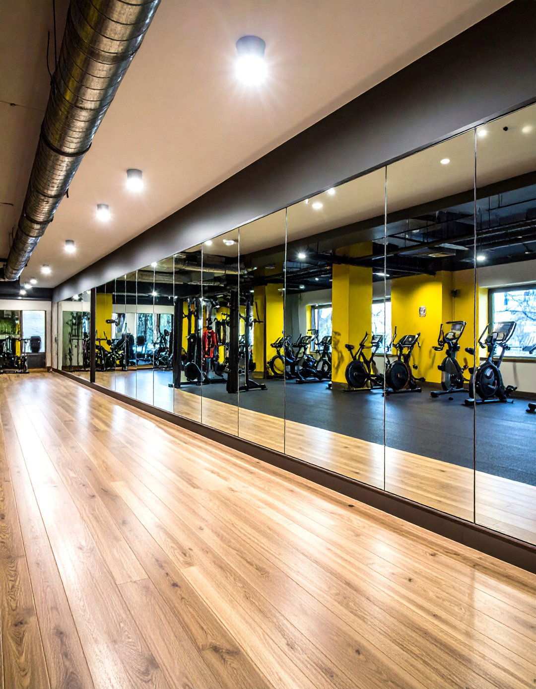 Safety Mirrors Expand Sightlines in a Basement Gym - 20 Basement Gym Ideas